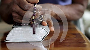 black man praying to god Caribbean man praying with black background stock footage