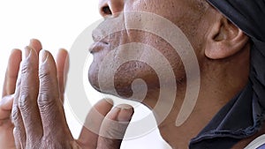 black man praying to god Caribbean man praying with black background stock footage