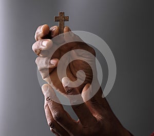 black man praying to god Caribbean man praying with black background stock photo
