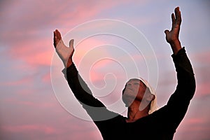 Black man praying to god stock photo