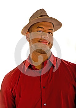 Black Man in a Red Shirt and Brown Hat Smirk