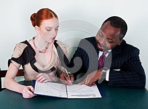Black man and redhead girl with documentation photo
