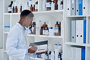 Black man, scientist and folder for stock in laboratory inventory for logistics, update and products. Doctor writing