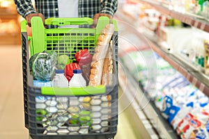 Black Man With Shopping Cart Buying Food In Supermarket, Cropped