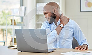 Black man, shoulder pain on laptop in stress and injury suffering from overworking at home. Stressed African male