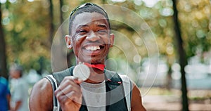 Black man, sportsman and happy face with medal for winning or success, marathon and long distance running. Athlete