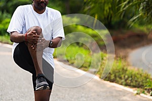 Black man standing wear feet shoe warm-up before run