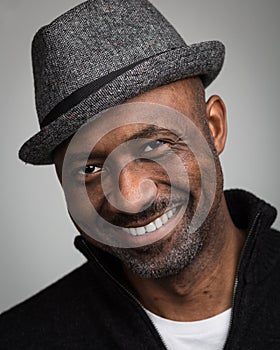 Black Man With Stubble Wearing A Hat