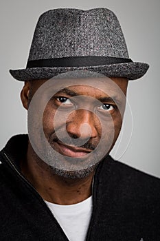 Black Man With Stubble Wearing A Hat