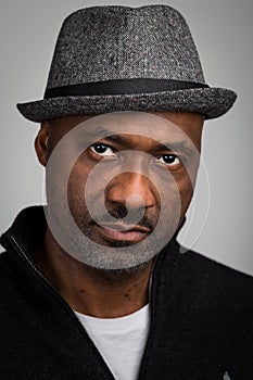Black Man With Stubble Wearing A Hat