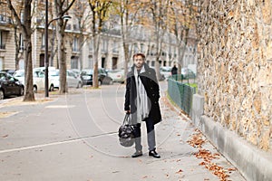 Black man walking with bag in paris france street fall