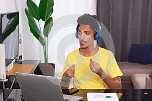 Black Man Wearing Yellow T-shirt at Remote Job