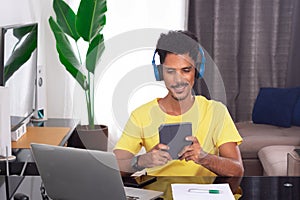 Black Man Wearing Yellow T-shirt at Remote Job