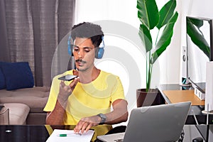 Black Man Wearing Yellow T-shirt at Remote Job in His House