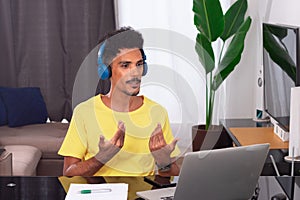 Black Man Wearing Yellow T-shirt at Remote Job in His House