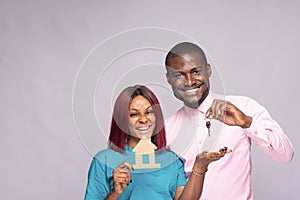 a black man and woman buying a house concept