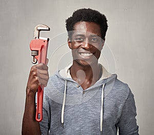 Black man with wrench