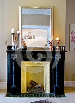 Black mantle with mirror & candlesticks