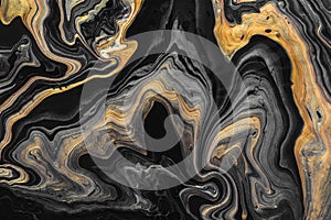 Black marble background with golden waves and curls. Abstract background or texture. Acrylic Fluid Art