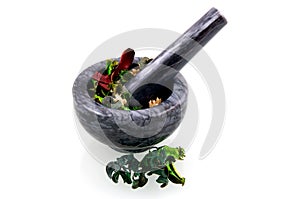 Black marble mortar with herbs