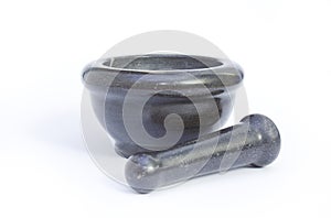 Black marble pestle and mortar on white background on center