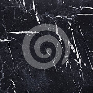 Black marble tile texture with white veining pattern