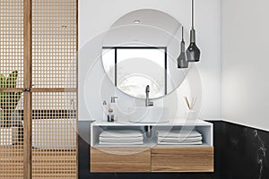 Black marble and white bathroom, tub and sink