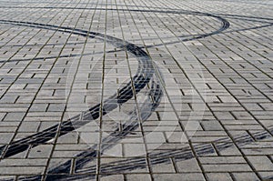 Black marks of braking tires on car wheels on the road