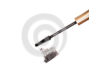 Black mascara brush stroke with applicator brush isolated on white background