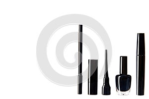 Black mascara, nail polish and lipstick, eye makeup brush