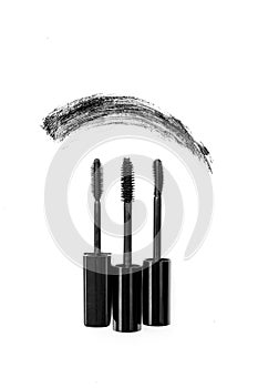 Black mascara smear with different types of brush brushes