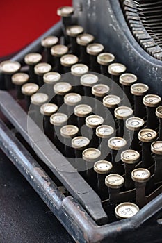 Black mechanical typewriter with white keys