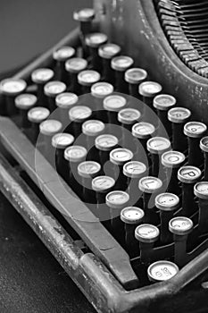 Black mechanical typewriter with white keys, black and white