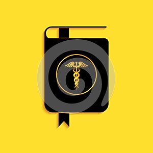 Black Medical book and Caduceus medical icon isolated on yellow background. Medical reference book, textbook