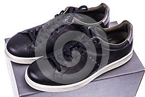 Black men`s sneakers with white soles