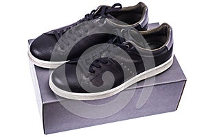 Black men`s sneakers with white soles