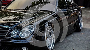 Black Mercedes Benz E320 W211 sedan