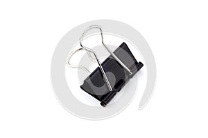 Black metal binder paper clip clamps isolated on white - image