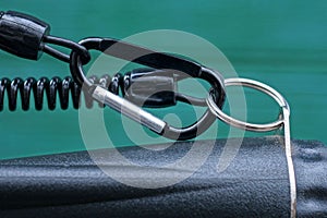 black metal carabiner clasp on a plastic wire