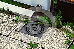 Black metal drain grate for draining rainwater