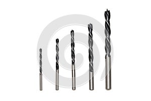 Black metal drill bits on white background isolated.