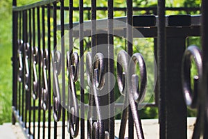 Black metal fence, Closeup, selective focus