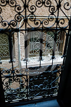 Black metal fence on an indoor window handmade in moroccan style