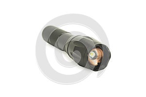 Black metal flashlight isolated on white background with clipping path