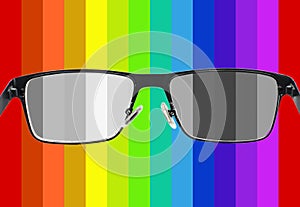 Black metal glasses on colorful background photo