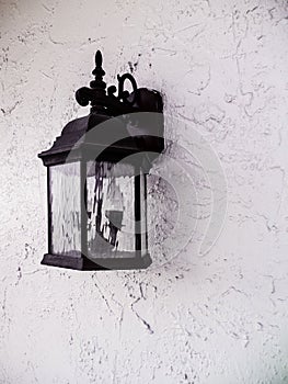 Black Metal Lantern On The Wall Of An Entry of a Building