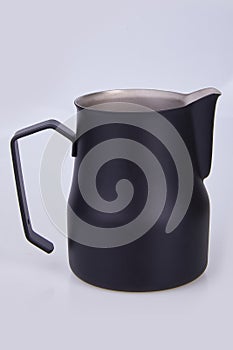 Black Metal pitcher for coffee making.