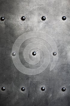 Black metal plate or armour texture with rivets