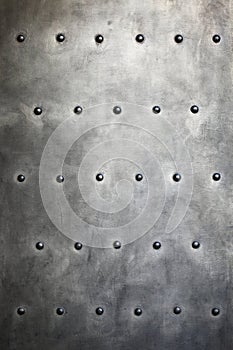 Black metal plate or armour texture with rivets