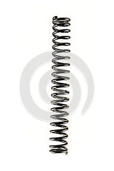 A black metal spring is shown in a white background